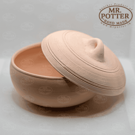 Handmade clay container with a lid, crafted by Mr. Potter, perfect for storage and home decor.