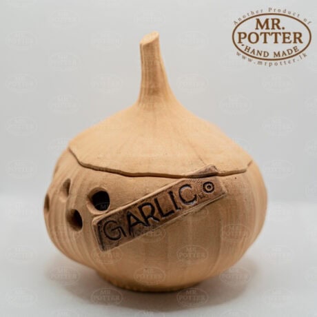 Handmade wooden garlic diffuser with natural finish and perforations for aromatic garlic infusion.