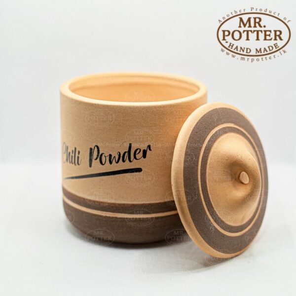 Handmade ceramic spice jar with lid, perfect for kitchen storage, by Mr. Potter.