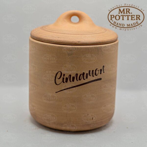 Colorful cinnamon spice jar, handcrafted ceramic container for kitchen storage, home decor.