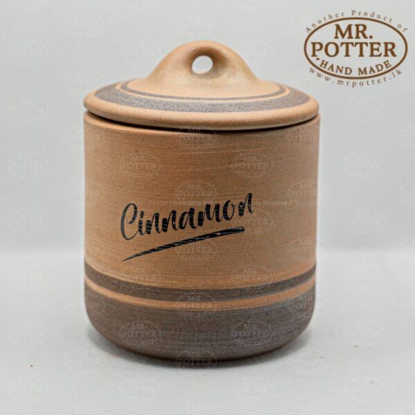 Handmade cinnamon spice jar with lid, crafted by Mr. Potter.